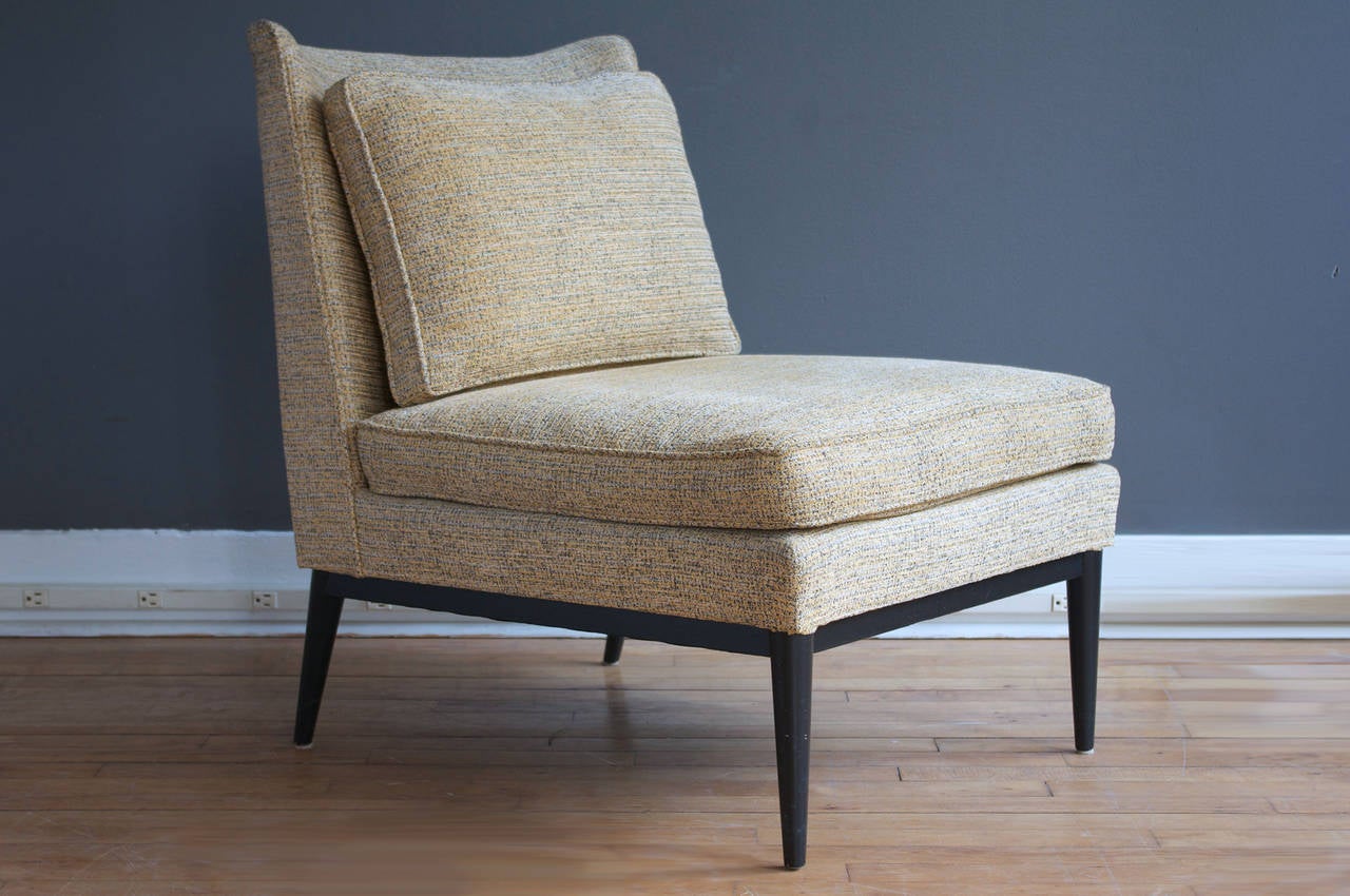 An elegant pair of slipper chairs designed by Paul McCobb for Calvin, circa 1950s. Slightly curved back rest and thin tapered legs create a graceful form that is also quite comfortable. 

Vintage upholstery is in good condition, but shows minor