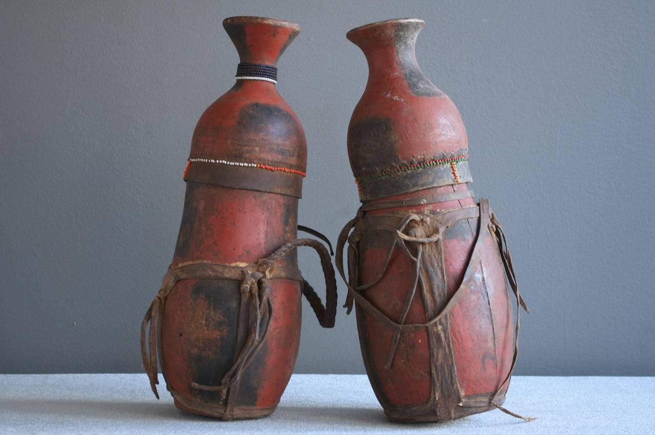 A pair of traditional carved wood Oromo vessels from Ethiopia, circa 1960.