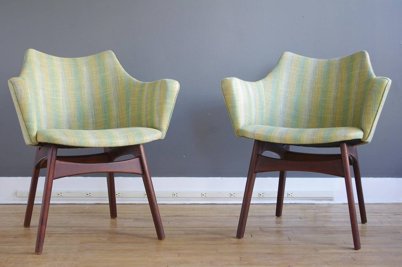 A pair of sculptural armchairs designed by Adrian Pearsall for Craft Associates, circa 1960. Each consisting of a solid walnut frame with recent Maharam upholstery.