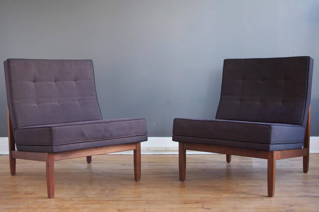 A pair of handsome slipper chairs designed by Florence Knoll for Knoll, circa 1955. 

Walnut frames are nicely constructed and in excellent vintage condition. Original upholstery and foam are ready for replacement.
