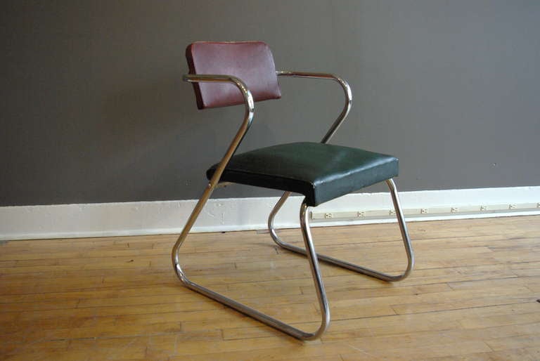 A tubular chrome armchair by Gilbert Rohde that would make a comfortable desk or side chair. The chrome is in excellent condition with no pitting, and the original Fabrikoid upholstery is fully intact with only minor signs of wear. Retains its