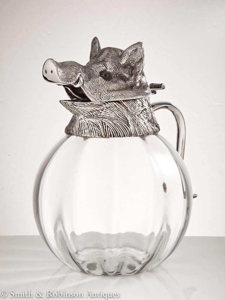 A very large & impressive boars head pitcher with hinged lid on a glass base , Spanish c.1960-65
A superb quality piece realised in highly detailed silver plate & fine quality glass body, all of which embodies a very substantial & striking pitcher.