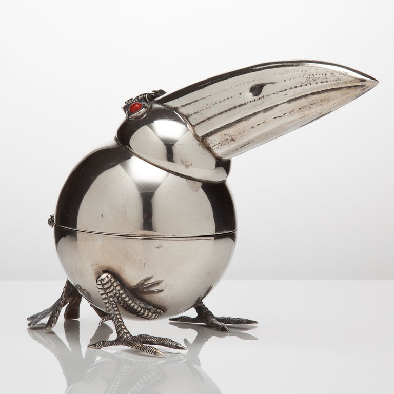 An Italian silver novelty lighter in the form of a bird c.1960. The beak acts as a handle to reveal the interior lighter which is in base metal. The makers mark is initialled BR.