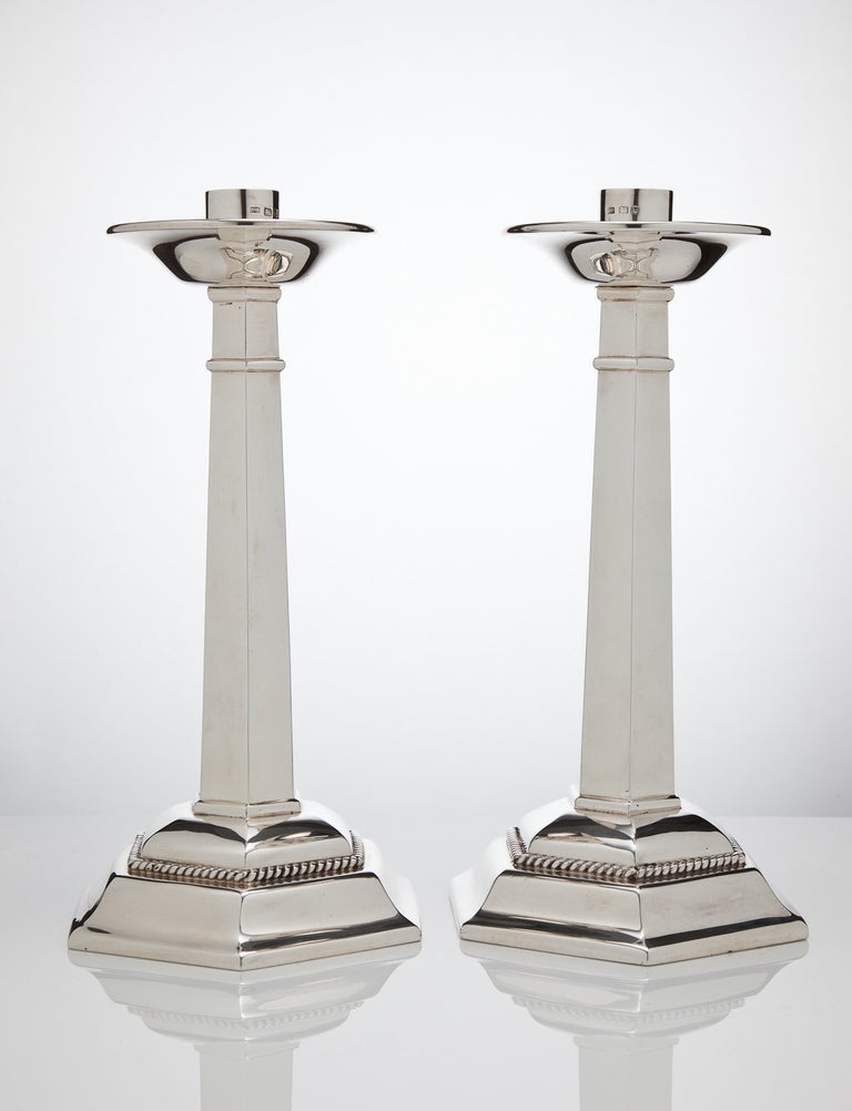 A stunning and large pair of English silver candlesticks of exceptional quality, created in Gothic design, all fully hallmarked and dated London, 1937 by makers Arthur Robert, Mayland.