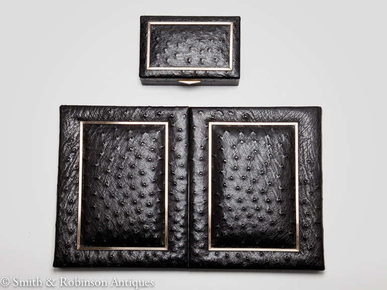 A beautiful Ostrich leather desk set by Asprey London, English, circa 1960. The folder reveals the original silk interior with two pockets.
The hinged box has a satin wood interior.
The exterior on both pieces are framed with a gilded mount border