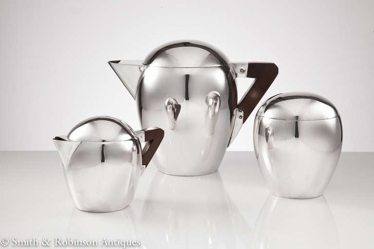 A rare Japanese art deco tea set beautifully realised in 800 silver c.1920.
In rounded form with an unusually detailed pictorial head on inner lid of sugar bowl as shown in the images.
Each piece has a finely executed interlocking lid to its