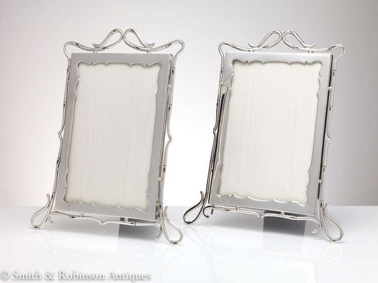 A beautiful pair of silver picture frames with the cast border replicating a bamboo design, fully hallmarked & dated London 1905.

Outer size 10