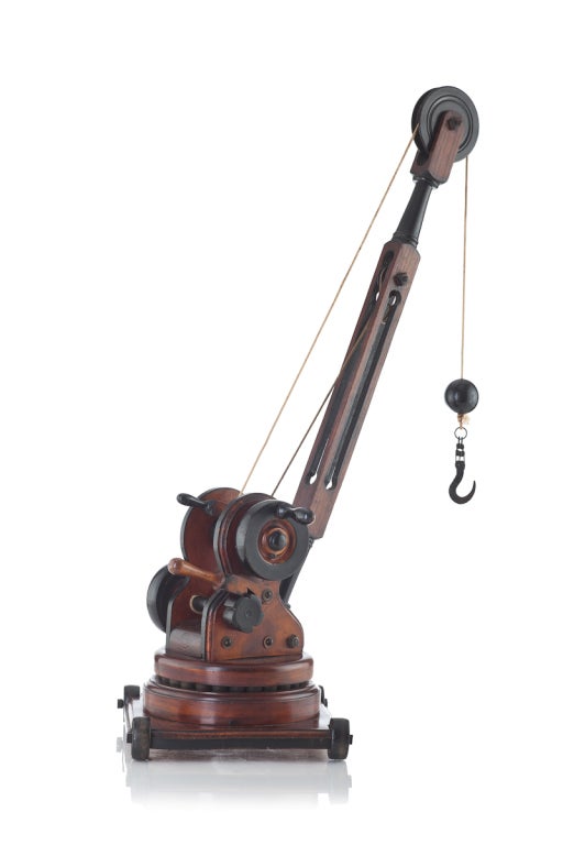 Early 20th century wooden model of a boys crane
made registered marks for circa 1908
origin English
This well balanced and well made model would make the perfect gift
the turntable is mounted on iron ball bearings the wheels are also cast iron