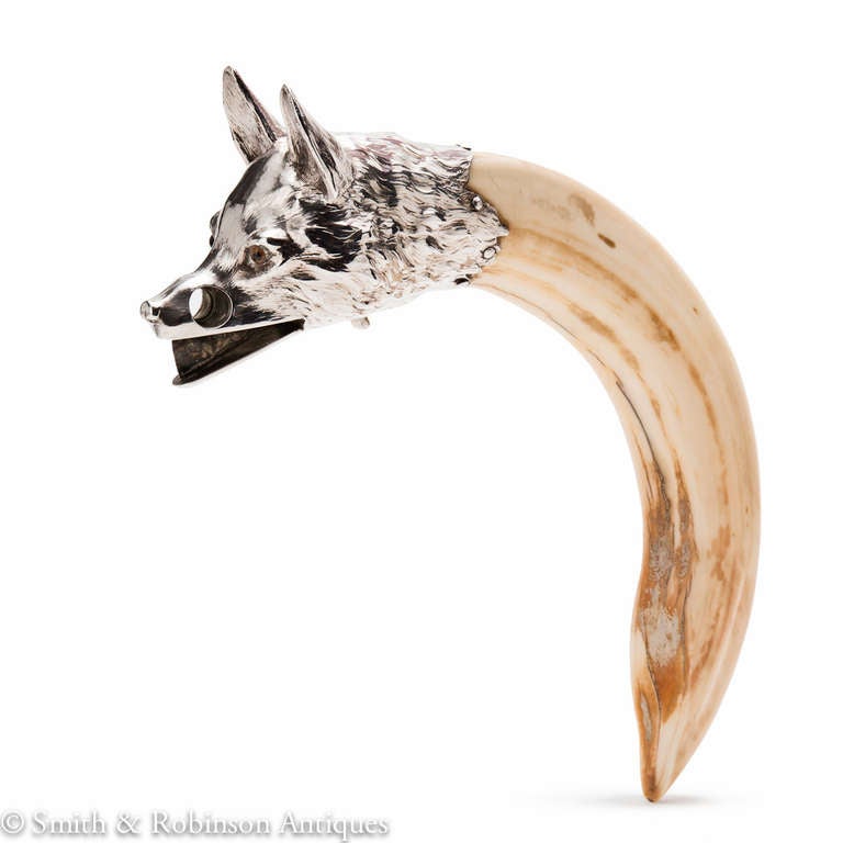 An impressive silver mounted cigar cutter in the form of a foxes head mounted on a curved hippo tooth handle Austrian, circa 1910-1915.

A Cites Licence will be required and supplied for export out of the EU.

We are always adding to our 1stdibs