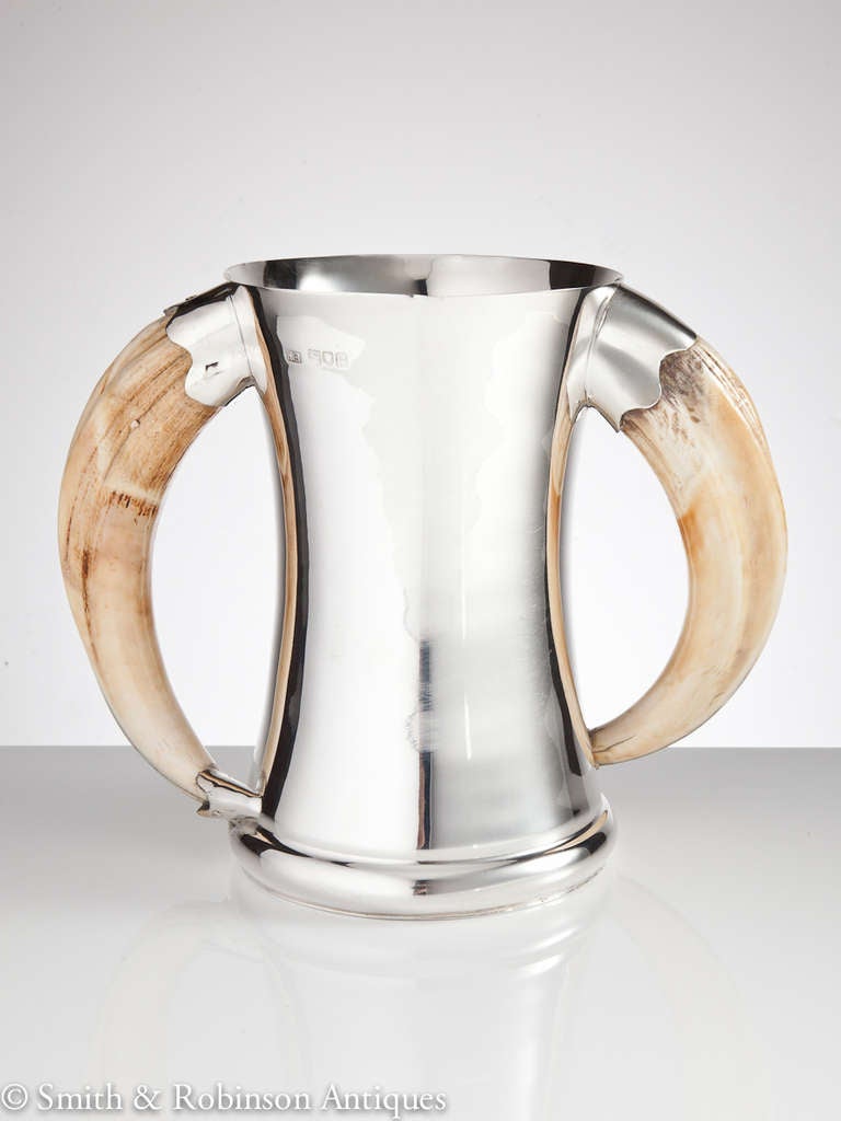 A great quality English silver tankard with waisted body and boar tusk handles made in London and dated 1900 by maker Robert Barnett.
This form of trophy has a colonial feel and was very popular with the Armed Forces at this time.

We are always