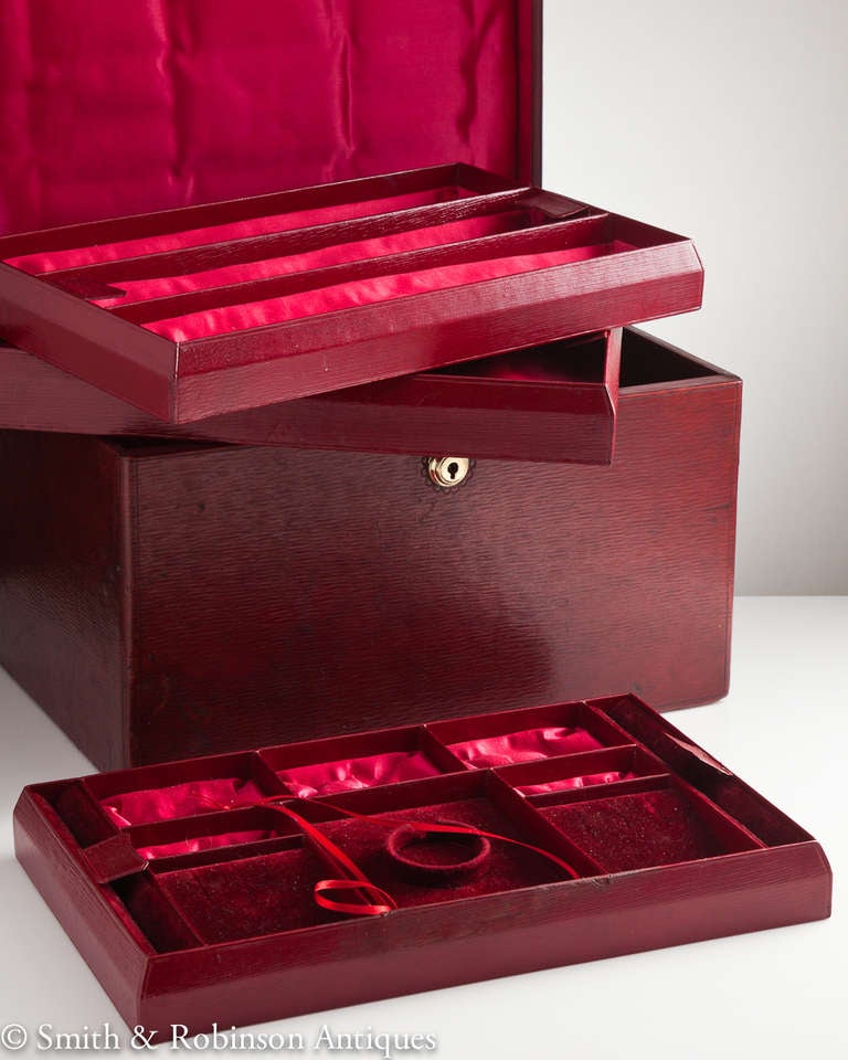 A beautiful ruby red morocco leather jewellery box in unused condition dating from 1910-15.
The dual purpose trays could be used either for jewellery or a watch collection.
The interior silk & velvet are also in excellent condition.
It has its