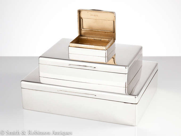 Fine Art Deco three-tier silver box with separate compartments for cigars, cigarettes and matches by the famous English silversmiths Mappin & Webb dated London, 1922.

The three sections reveal compartments for cigars and shorter cheroots with