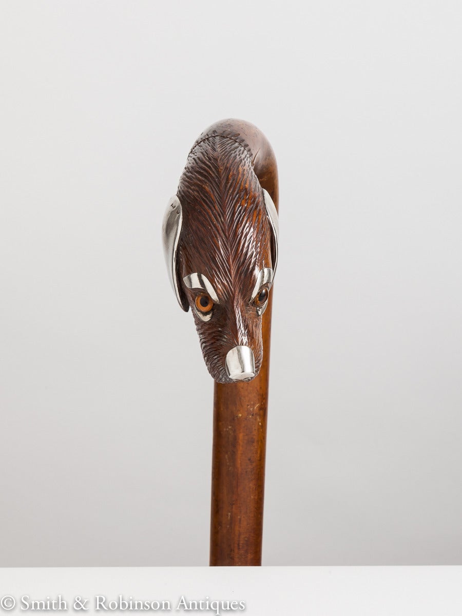 An unusual Malacca wood walking stick with decorated handle in the form of a dogs head that has been embellished with silver ears and also applied to eyes and nose, French, circa 1915

We are always adding to our 1stdibs catalogue so be sure to