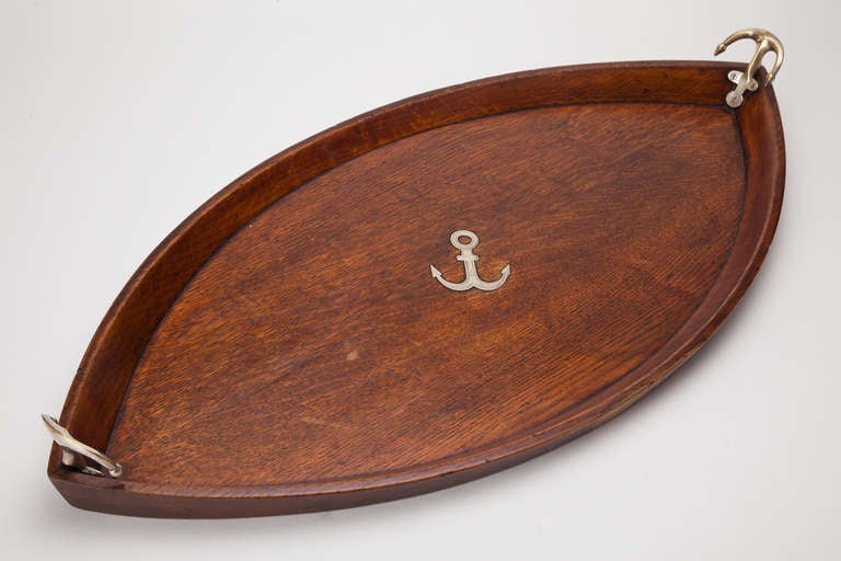 A large and splendid nautical boat shaped oak tray with plated anchors at both ends and with the inlaid motif of the same in the centre, English, circa 1880-1890

We are always adding to our 1stdibs catalogue so be sure to add us to your favourite