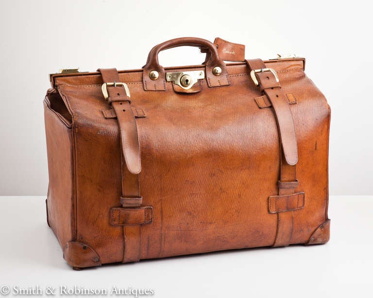 A large leather Hunting Kit Bag made by the original family firm of Tanner Krolle & Co. Ltd., for Harrods of London c.1970.

Full height when open including the handle is approx. 24