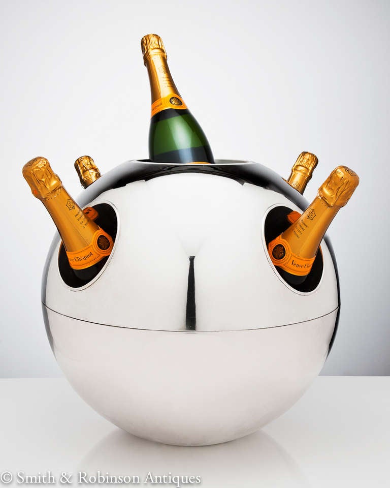 The ultimate champagne cooler, large & impressive, spherical silver-plated form, by Teghini , Firenze , Italy c.1970
Holds up to 5 bottles as shown in the images.  The top lid reveals an original ice bucket container and whereby it can also be used