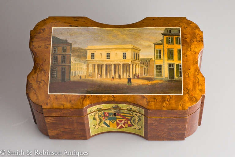 A exquisitely painted Spa tea caddy.
The exterior painted lid sets this caddy apart depicting formal buildings of the time with a air of sophistication.
The sides & reverse panels give, I would imagine,a view of surrounding countryside.
The