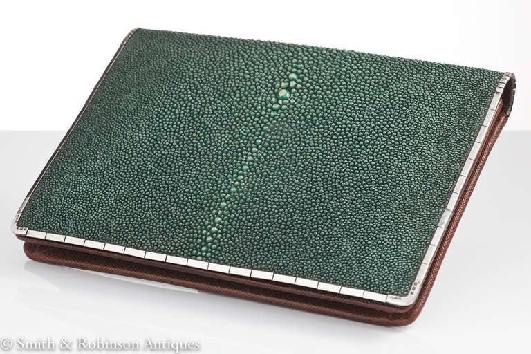 A elegant Art Deco shagreen clutch purse with English silver border which is segmented for flexibility, complete with it's original interior including fixed purse as shown, London 1929.

We are always adding to our 1stdibs catalogue so be sure to