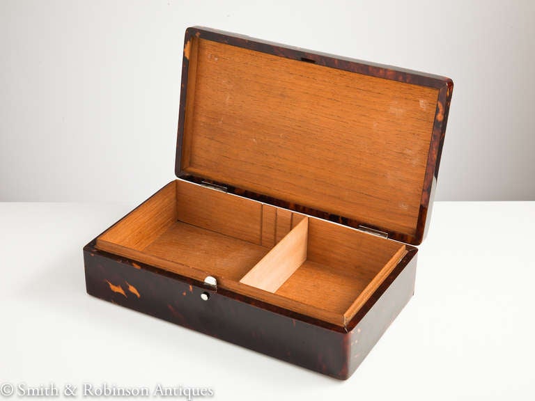 A superb quality veneered tortoiseshell cigar box with silver mounts & attractive scrolled decoration 