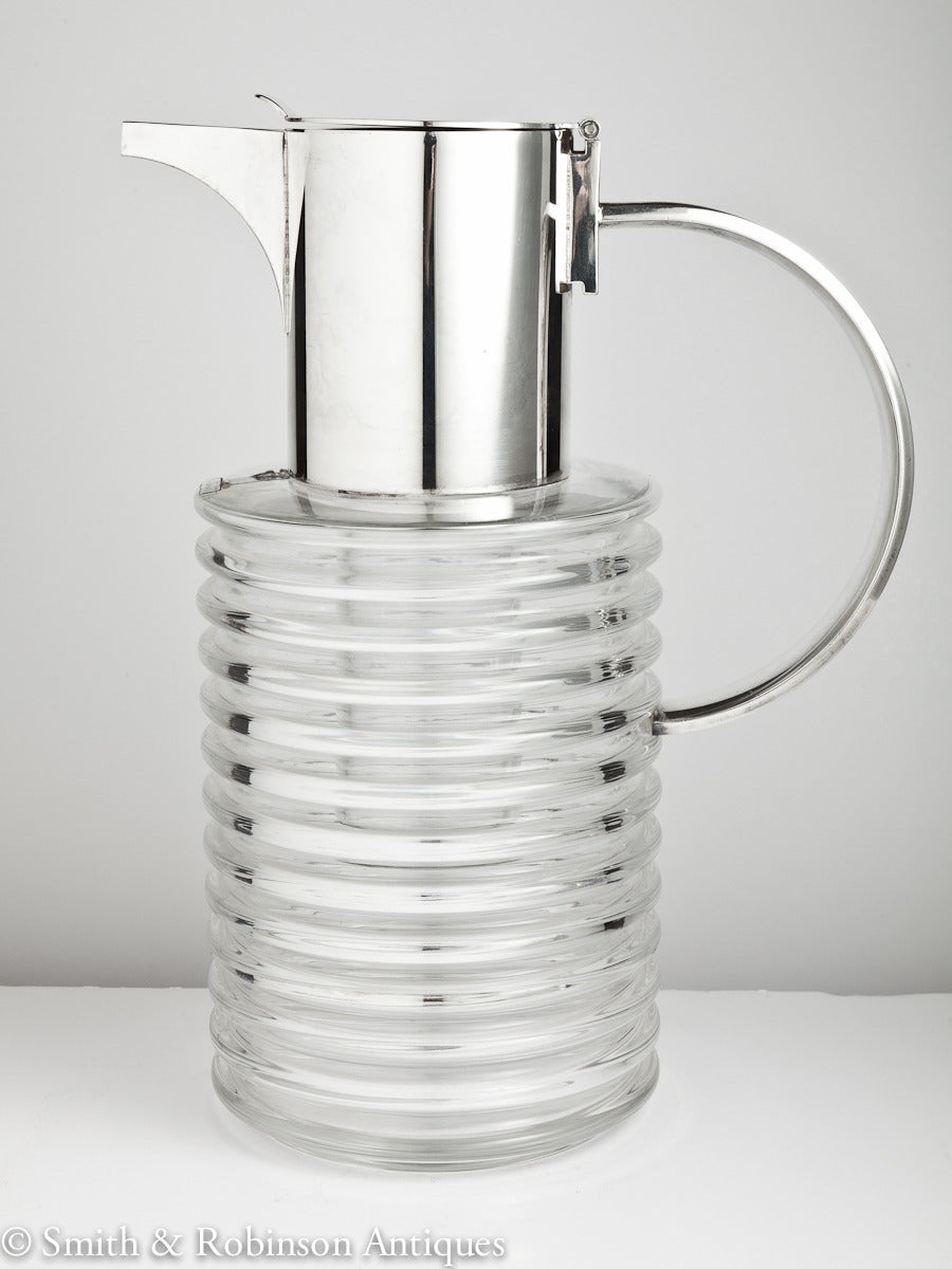 A large mid-20th century Italian glass and silver plated lemonade jug with integral ice container designed by Sergio Asti, Italy, circa 1965

Member of Bada & Lapada.