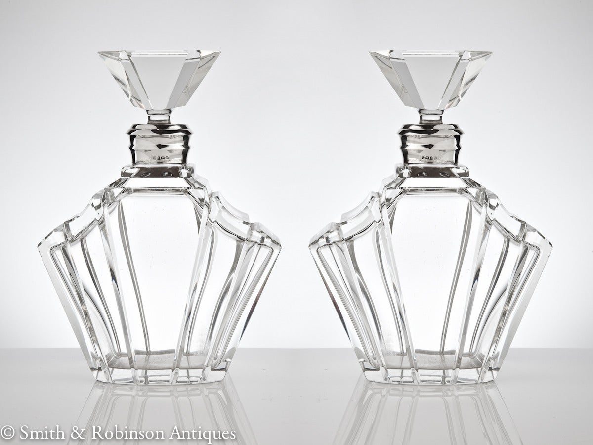 A rare pair of pure Art Deco decanters by makers Walker & Hall, dated Birmingham, 1938.
An iconic fan shape that really stands out. 

We are always adding to our 1stdibs catalogue so be sure to add us to your favourite dealers and visit our