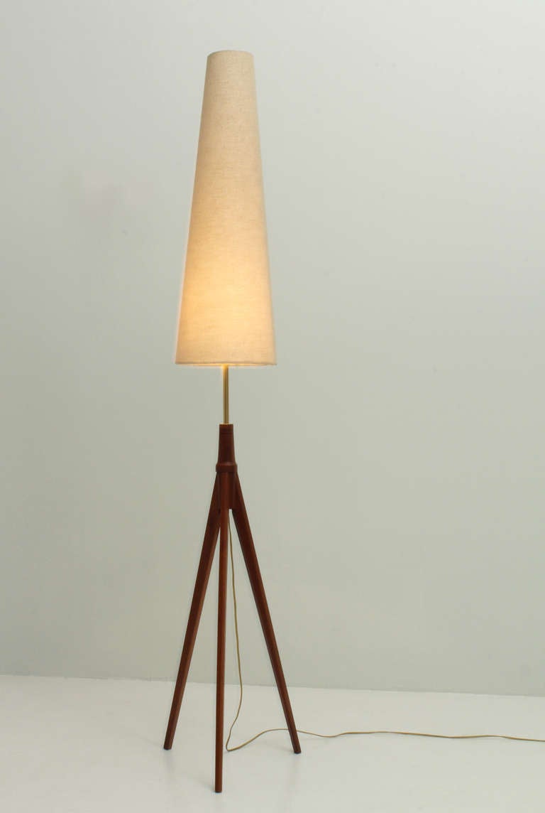Scandinavian tripod floor lamp from 1950's. Brass, teak wood base and conical shade with new fabric.