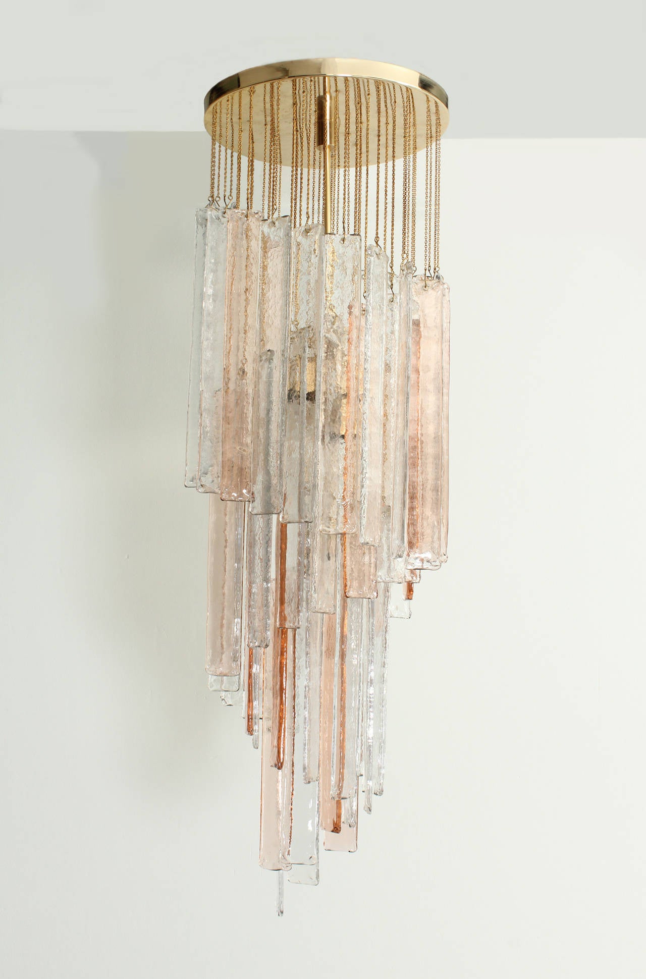 Large chandelier by Mazzega, Italy, 1960's. Clear and pink handblown Murano glass with brass top and chains. Four lights.
