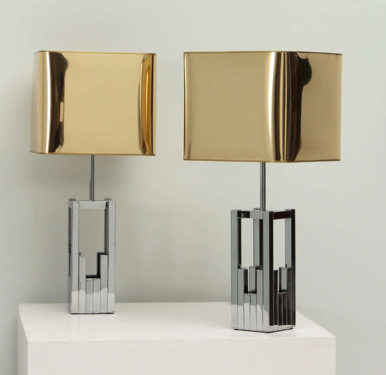A pair of table lamps by Lumica, Italy, 1970's. Chrome bases and new golden plastic shades.