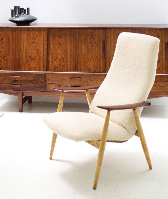 Highback armchair designed by Ollie Borg for Asko, Finland in 1960's. Birch and teak wood frame with new synthetic sheepskin fabric.