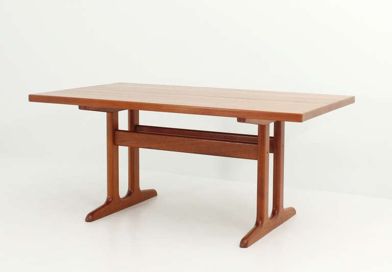 Dining table produced in Denmark in 1960's. Thick top in solid teak wood with rich grain with two extensions.