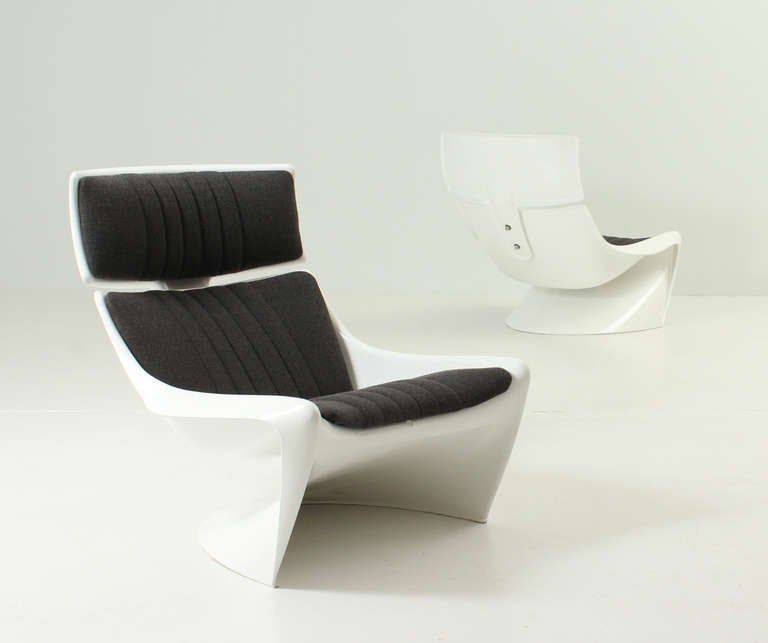 A pair of President lounge chairs designed in 1968 by Steen Ostergaard for Cado, Denmark. Moulded fiberglass reupholstered with Hallingdal wool fabric. Signed.