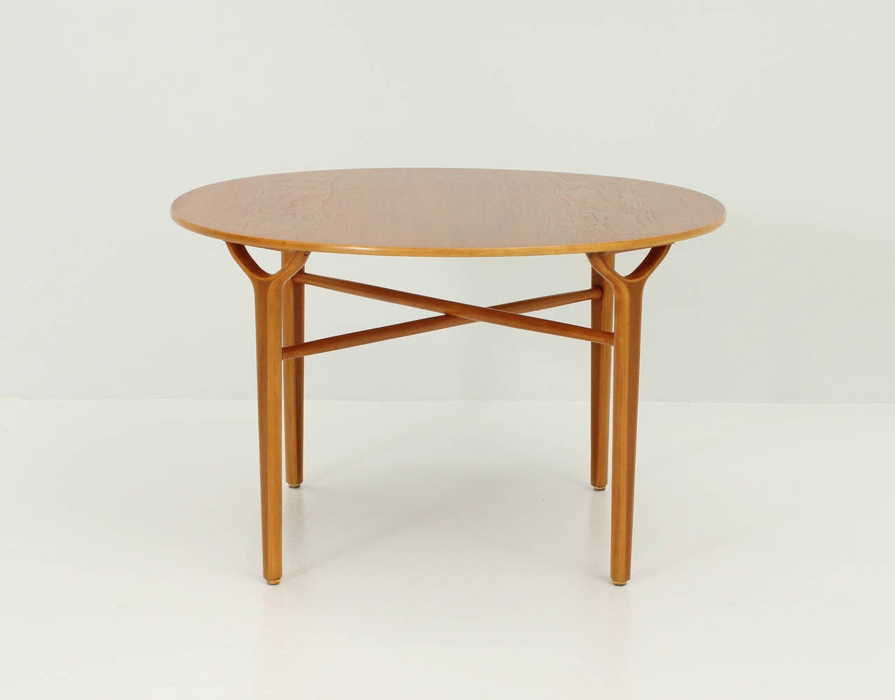 Ax table designed by danish designers Peter Hvidt and Orla Mølgaard-Nielsen in 1950 for Fritz Hansen, Denmark. Beech and teak wood.