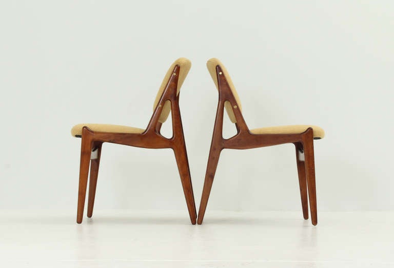 A pair of Ella chairs designed in 1962 by Arne Vodder for Vamo, Denmark. Teak wood and new upholstery.