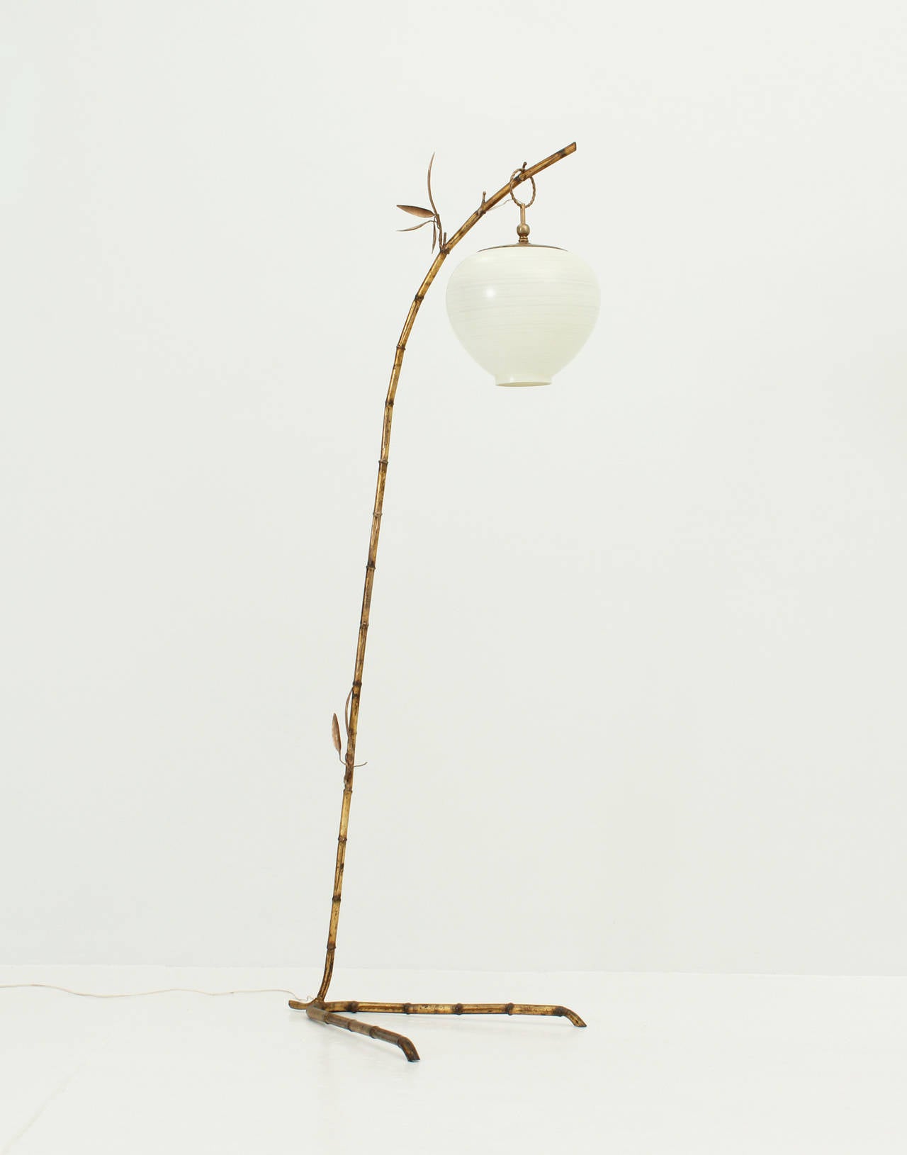 Floor lamp in gilt metal faux bamboo with white opaline reflector with hand painted details. Spain, 1950's.