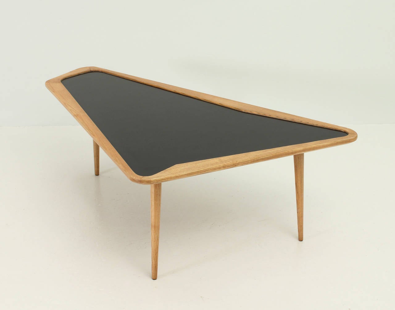 Free-form coffee table designed in 1956 by Charles Ramos, France. Oakwood and laminated top.