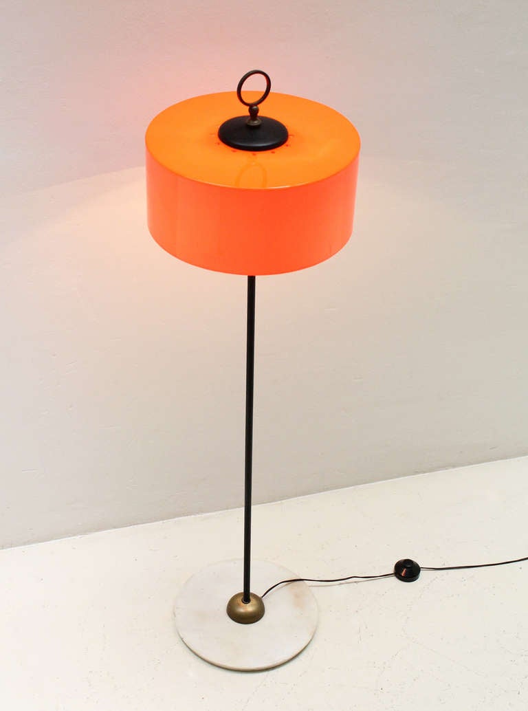 Italian floor lamp from 1960's by unknow designer. Orange plastic shade with three bulbs, black enameled stem and fittings, brass and marble base.