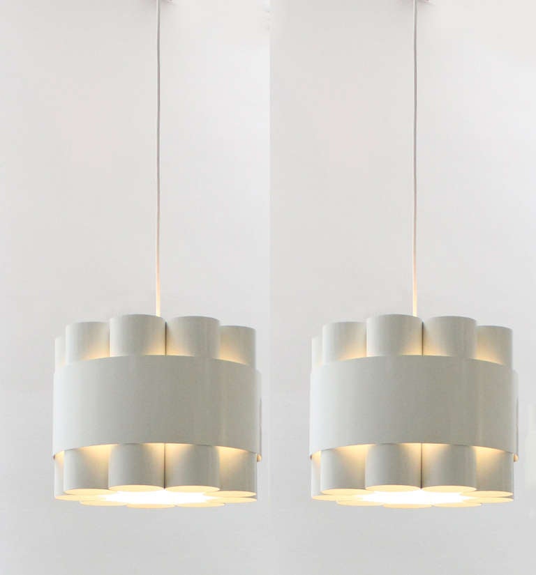 A pair of Zero ceiling lamps designed by Jo Hammerborg in 1970 for Fog & Mørup, Denmark. White enameled metal structure that produce an amazing lighting.