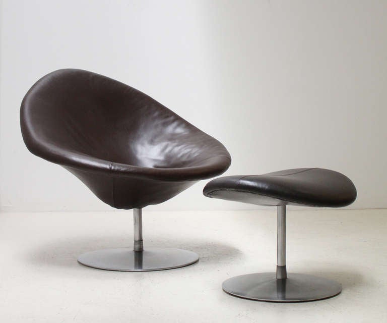 Globe chair and ottoman models F422 and P421 designed by Pierre Paulin in 1959 for dutch company Artifort. Rare version upholstered in chocolate brown leather with swivel steel bases.  Ultra comfortable.