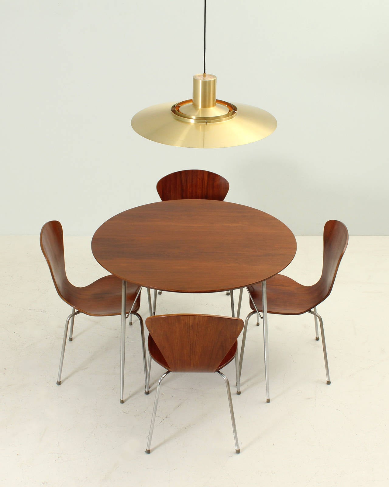 Rosewood dining set sold in 1950's in Campo & Graffi shop Home in Torino, Italy. This table, similar to the Arne Jacobsen table was imported only the top of the table from Denmark and the base is a Campo & Graffi design with the characteristic