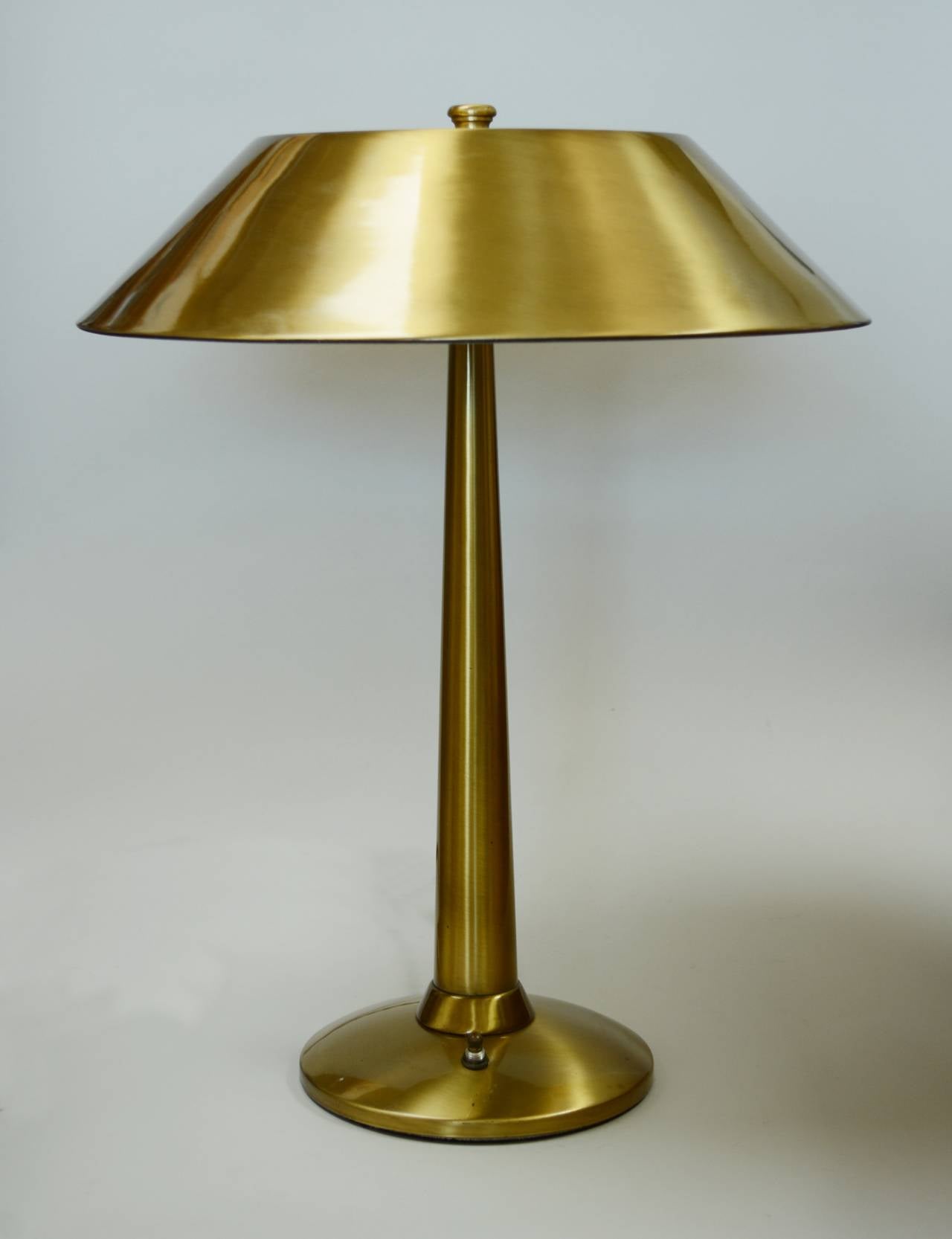Desk lamp by National Lighting Company. The brass is a brushed finish. This lamp has two light bulb sockets. The cord is new twisted brown rayon with a vintage style plug.
