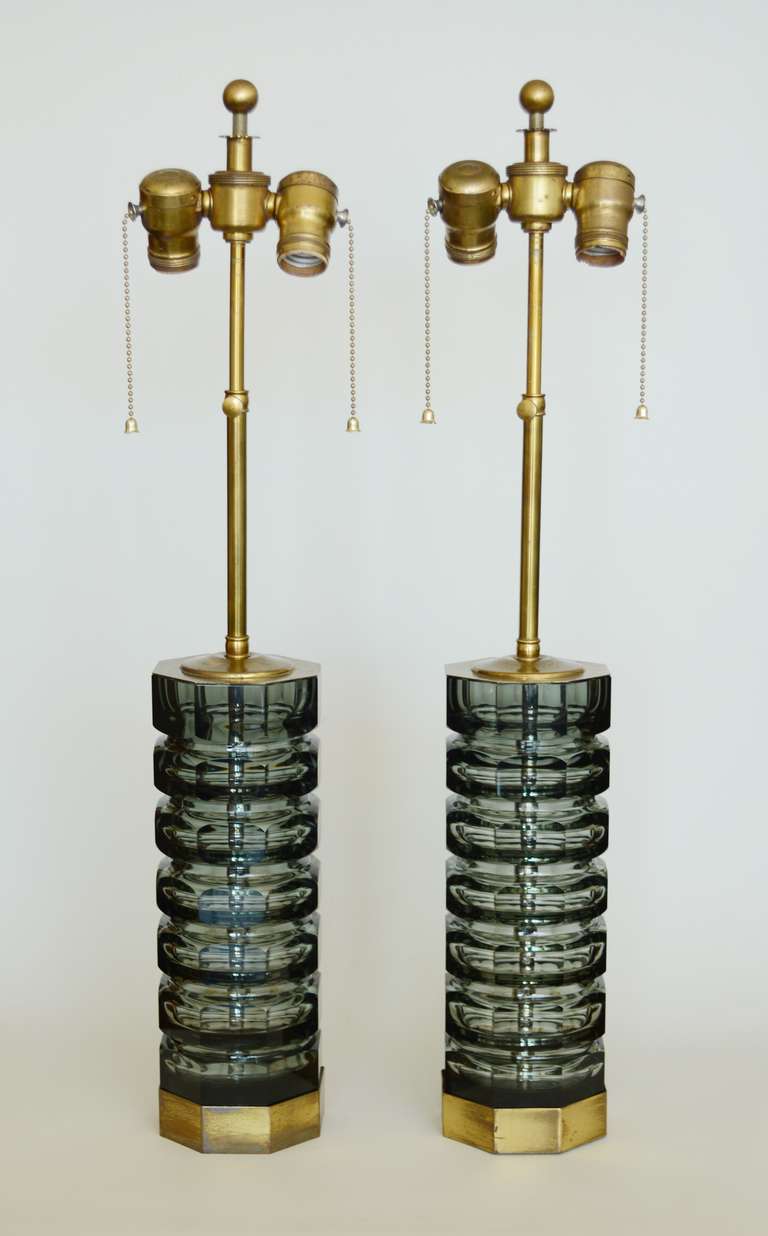 A pair of Czech cut glass vases as lamps. These are most likely Moser Glassworks. These lamps have custom made bases and caps. The height is adjustable from 23