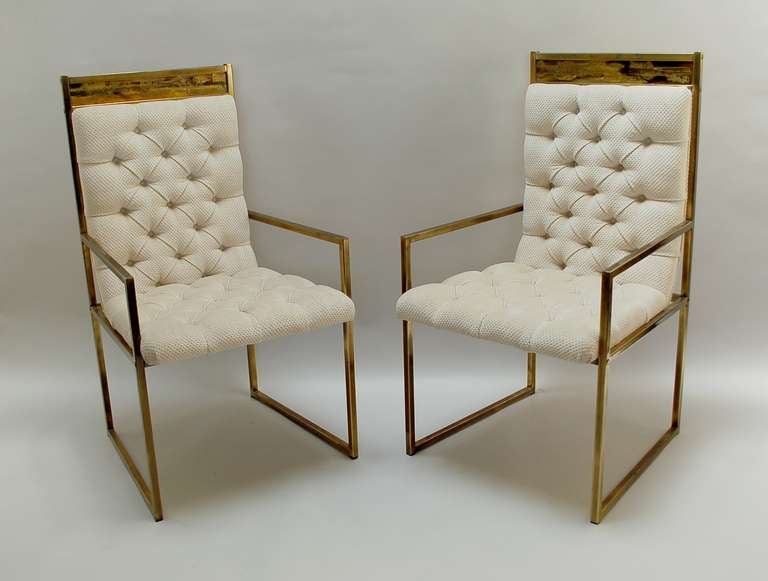 Pair of brass finish armchairs with tufted upholstery by Mastercraft. Each chair is topped with a Bernard Rohne acid etched detail. The upholstery is original and in good condition. 