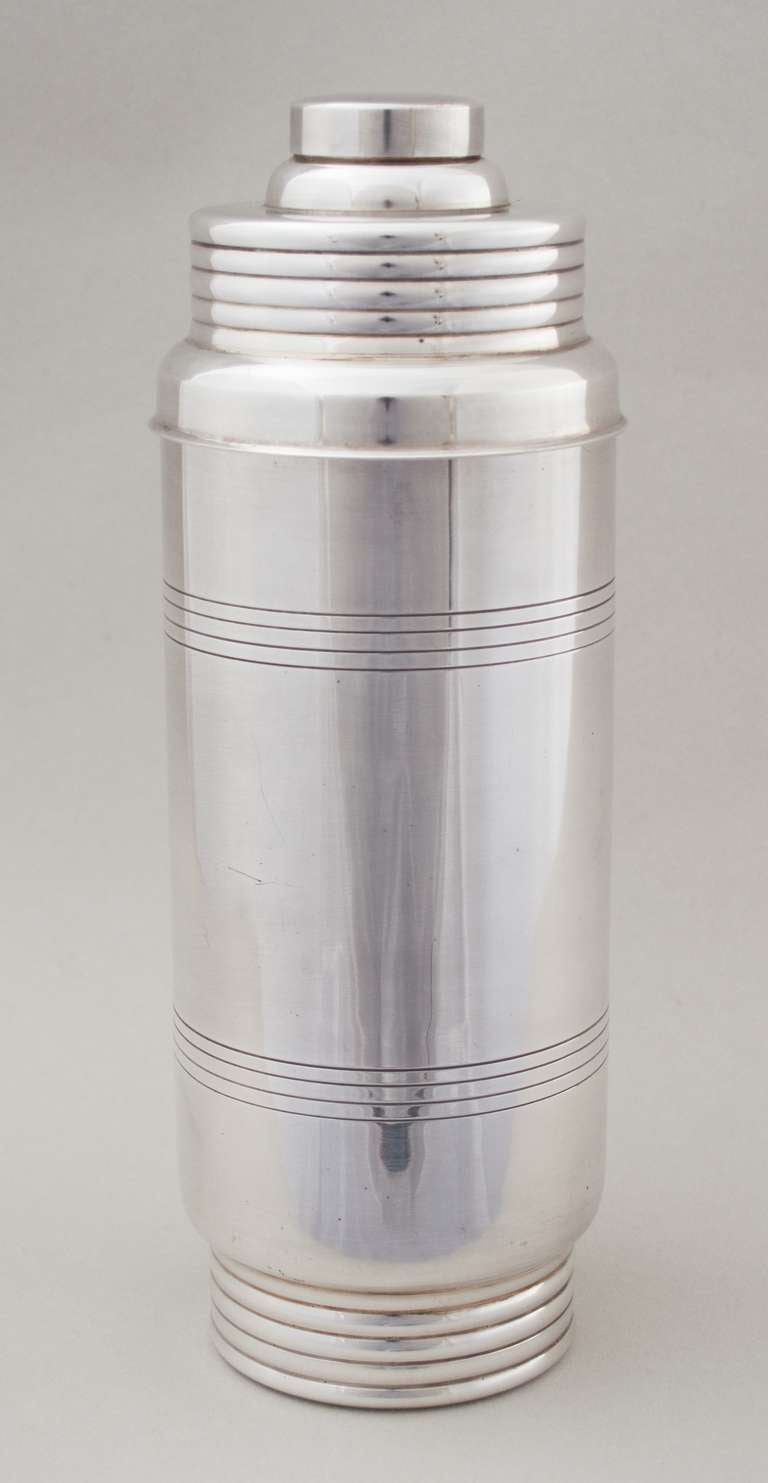 Art deco silver plate cocktail shaker by Modern Metal Spinning of Los Angeles. The interior of this has a gold wash. 