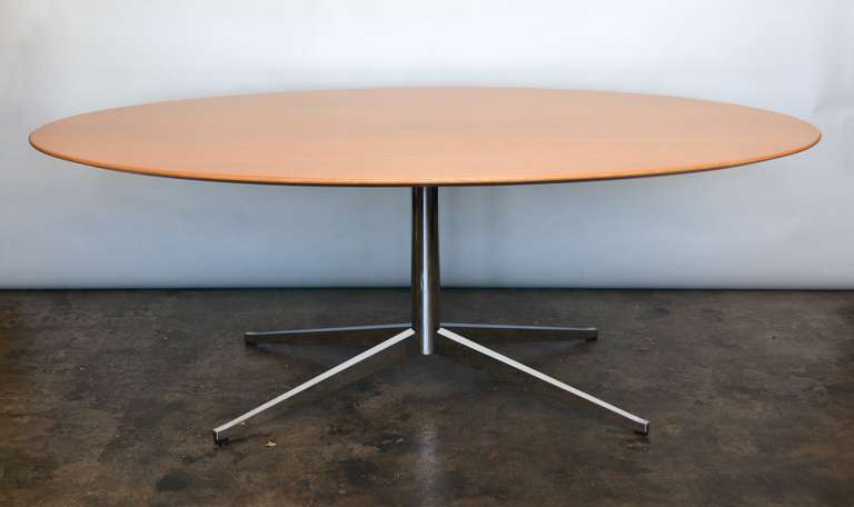 Oval oak top dining or conference table by Florence Knoll. The top has been newly refinished.