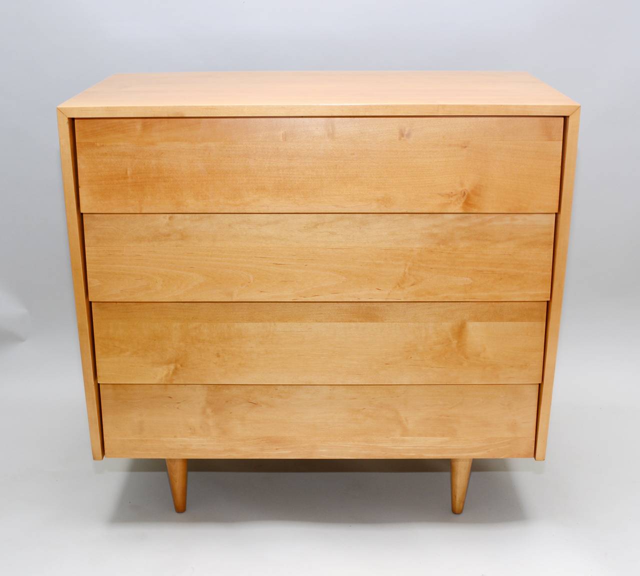 Early Knoll chest of drawers designed by Florence Knoll in 1947. This is solid maple. The top drawer is divided and the lower three are open. The chest has been refinished.