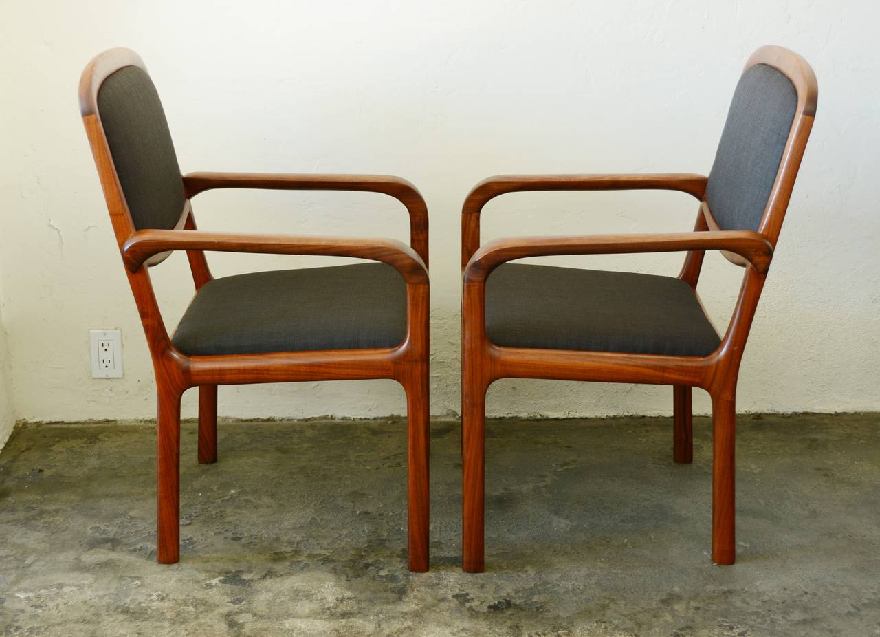 Two walnut frame studio Craft chairs. These are very well-made with great joinery detail. The chairs have an original lightly cleaned finish and newer upholstery.

       