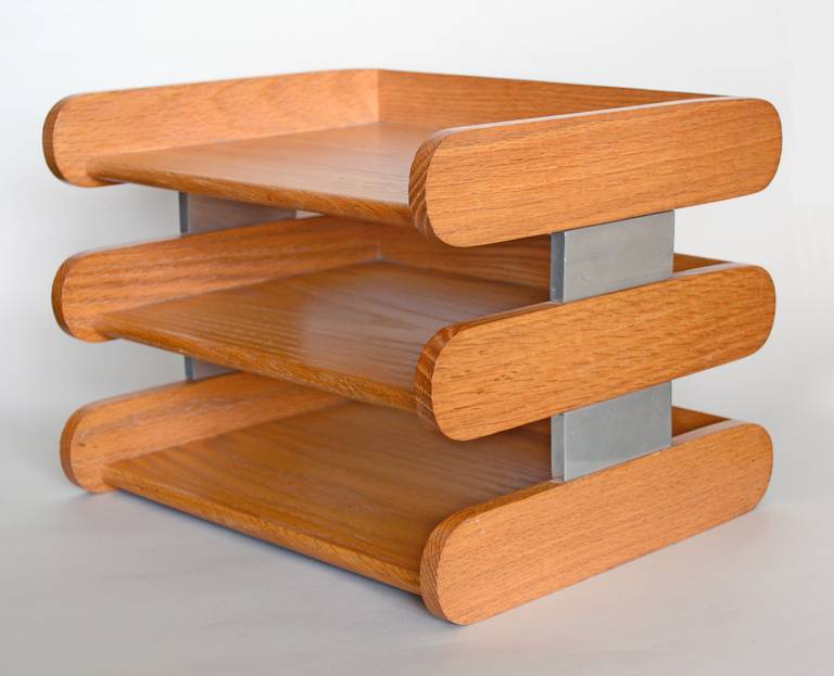 Desk top letter tray by Peter Pepper Products. The solid oak trays are supported by aluminum columns.