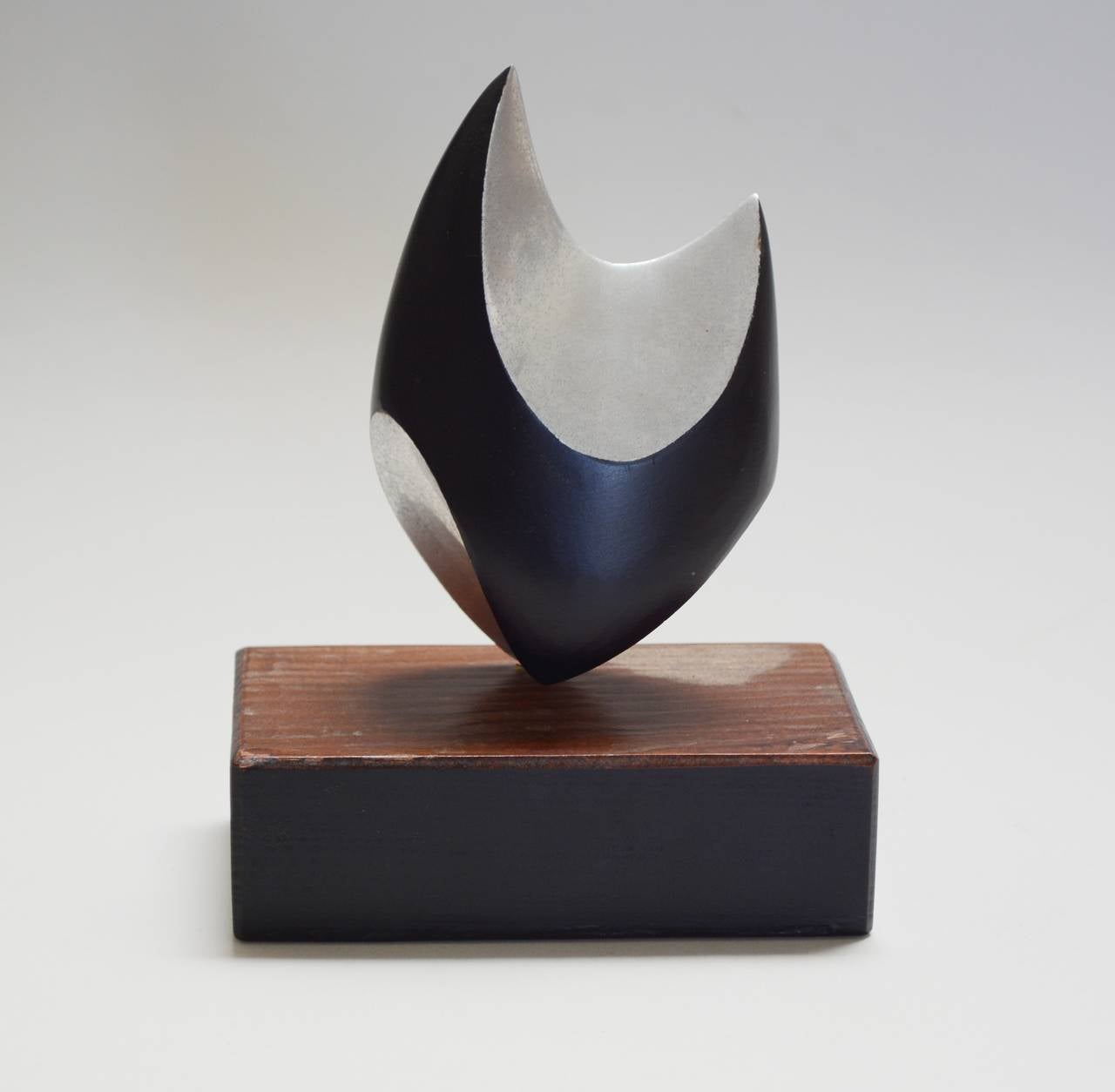 Aluminum sculpture by artist and architect Burke Rutherford. Burke has a number of large outdoors commissions on the San Francisco Peninsula. This piece is dated 1969. Dimensions given include the base.