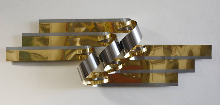 Large brass and brushed steel wall sculpture by Jere. This is dated 1989.