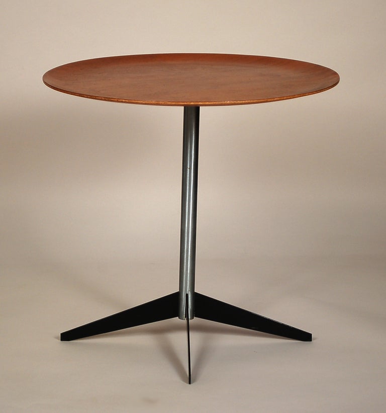 Table designed by George Nelson for Herman Miller. This table has a molded teak plywood top with a brushed chrome base and enameled legs. This retains its original finish.